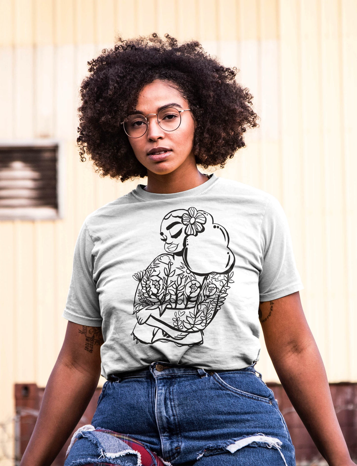 Black woman with glasses wearing Bouquet Skin T-Shirt in White. shop art mogigi Shopify, black owned business, black woman art, natural hair art, black girl magic, custom graphic art tshirts, curvy body figure line art, urban streetwear, black art by Gigi Moore, Virginia artist in Norfolk, Portsmouth, Suffolk, Chesapeake, Virginia Beach, shop 757 small businesses,