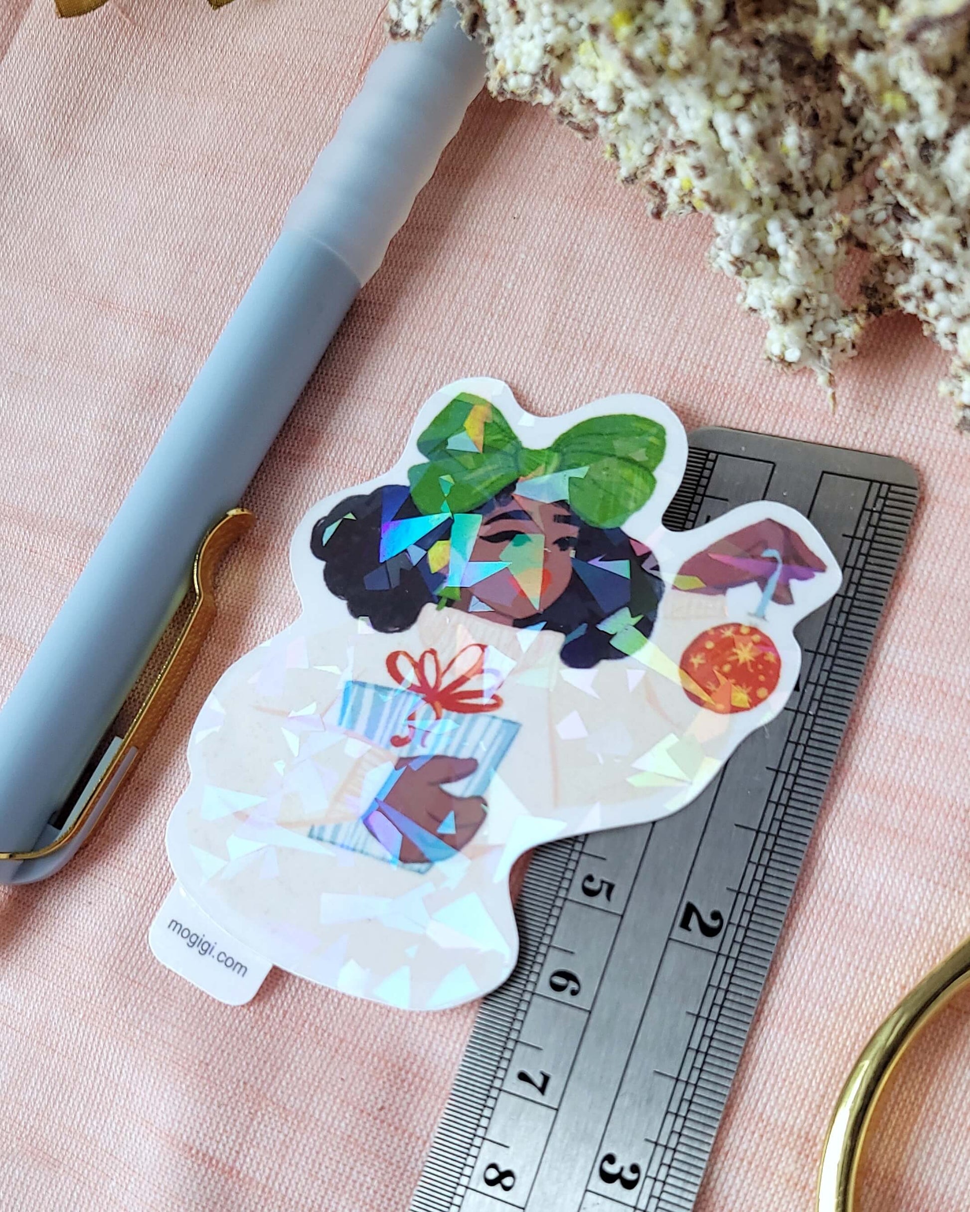 Christmas Bow Girl MoGigi™ and Elyse Mountains Ski Lodge Sticker Collaboration, black woman natural hair art by illustrator Gigi Moore based in Virginia. Unique holographic waterproof custom illustrated stickers, decals available on mogigi shopify art store.