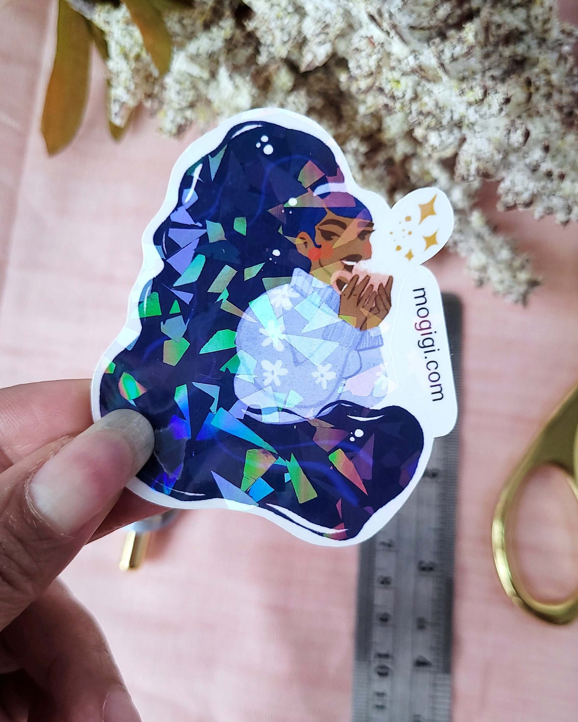 Tis The Season Waterproof Holographic Sticker, MoGigi™ and Elyse Mountains Ski Lodge Collaboration, black woman art by Virginia illustrator Gigi Moore, art shop loving created by black female artist, illustration and design services serving nationwide, portsmouth, virginia beach, norfolk, chesapeake, hampton roads, represented by shannon associates.